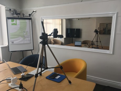 Usability lab interior with devices, camera and one-way mirror