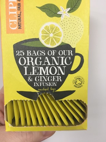 A box of tea bags with a slot at the bottom, but all the bags are sideways and won’t come out.