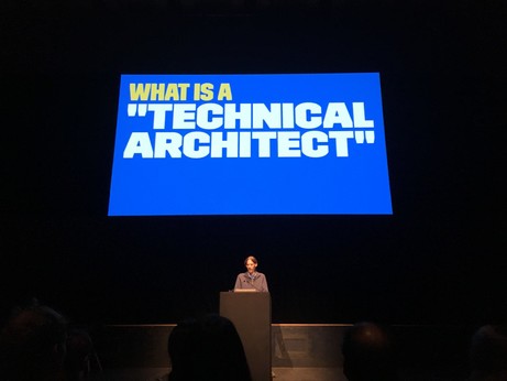A projected slide with “What is a technical architect?” written on it