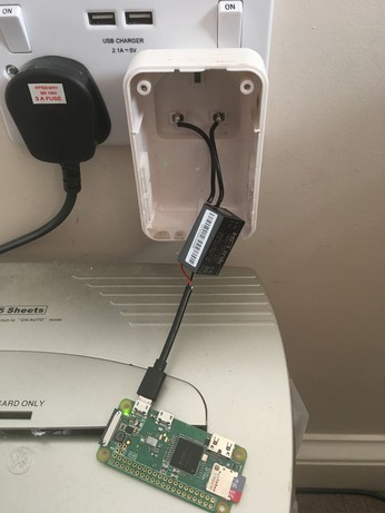 A raspberry pi zero wired straight into a mains plug via a small transformer