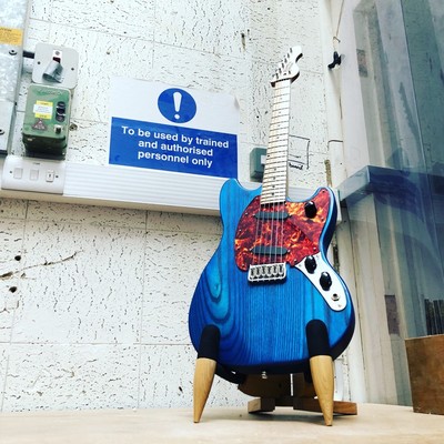 A blue offset guitar that I made.