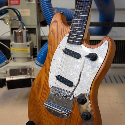 An orange offset guitar that I made.