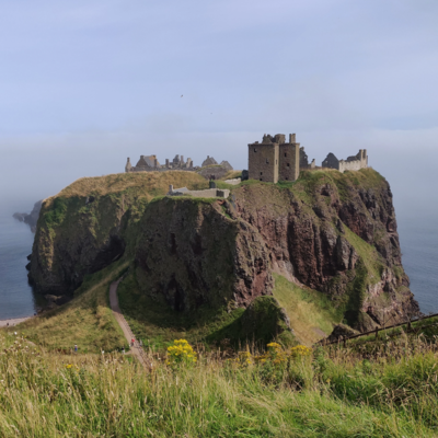 Castle buildings on a rocky outcrop.