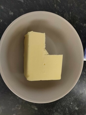 Block of butter with the north-west quadrant cut out.