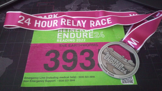 Race bib number and medal for Endure24 hour relay race 