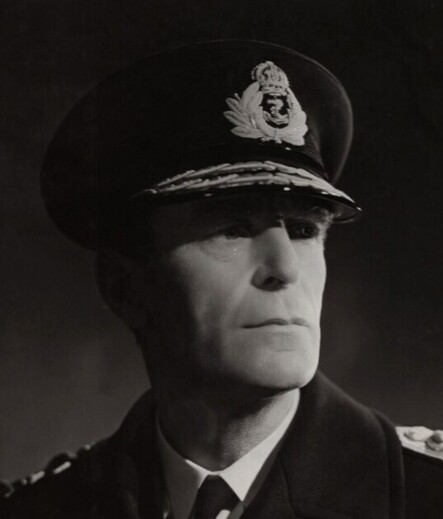 vian, in uniform, all clean shaven and stoic
