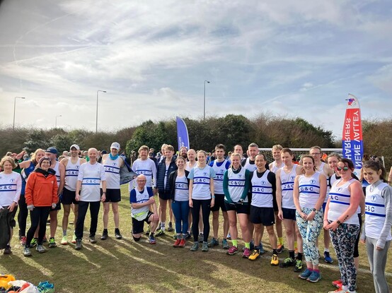 Group photo of the Cambridge & Coleridge AC members at the Frostbite race. All wearing club vests and ready to run 