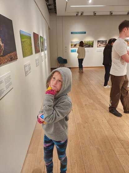 Freya holding her chin looking at art dahlin