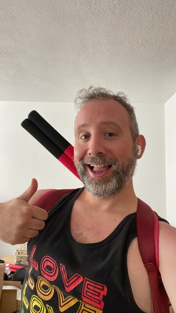 Martin ready to go in a Love Love Love vest top. Escrima on back. Thumbs up.