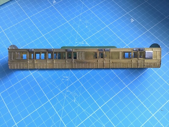 A scale model railway coach body. It’s made of photo-etched brass, which has allowed the wooden framework and panelling to be recreated. Small tin-lead alloy castings have been fitted for door ventilators and the lookout for the guard. I’ve got 16 of these on the go as a commission job.