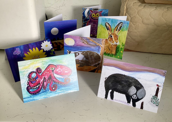 A selection of art cards octopus, pig, badger, hare, owls, flowers.