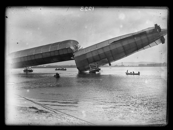 British airship Number 1 in a position that no doubt led to a spontaneous release of number twos. it's lying with its back broken, wallowing on a Barrow sandbank.