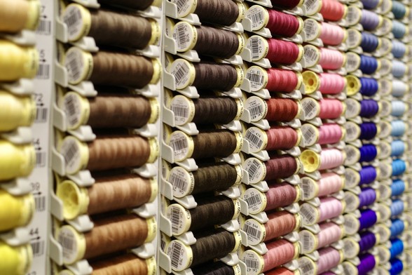 Colourful rolls of cotton on a shop display (most of them are brown, it has to be said)