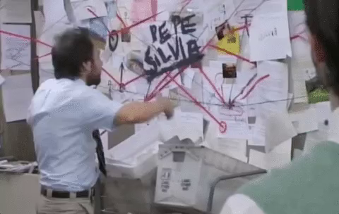 Always Sunny Reaction GIF with the conspiracy wall and the character trying to piece it all together