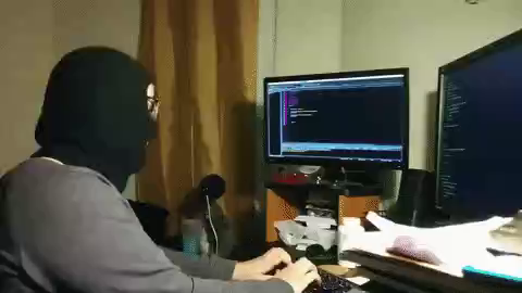 GIF of a hacker in front a computer dancing