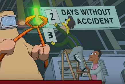 Screenshot of the title sequence of The Simpsons showing the interior of the Springfield nuclear power plant. In the foreground is a person, dressed in protective gear, carrying a glowing rod. In the background one of the characters changes a sign from 2 to 3. The sign reads “Days without accident”.