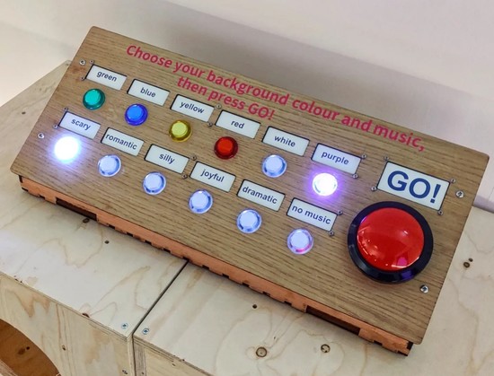 A wooden console with LED arcade buttons