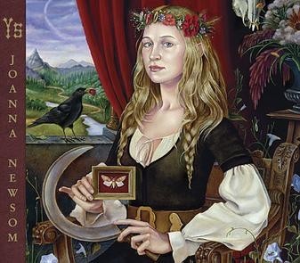 The cover of the album Ys by Joanna Newsom. It depicts the artist in a medieval or fantasy style painting holding a scythe, a pinned and framed butterfly or moth and various other paraphernalia. She wears a green dress over a cream blouse. She is sitting by a window which is dressed with a rich red velvet curtain. On the windowsill sits a blackbird with a red berry in its beak. The scene outside the window is a mountainous forested landscape with a meandering river running through it. 