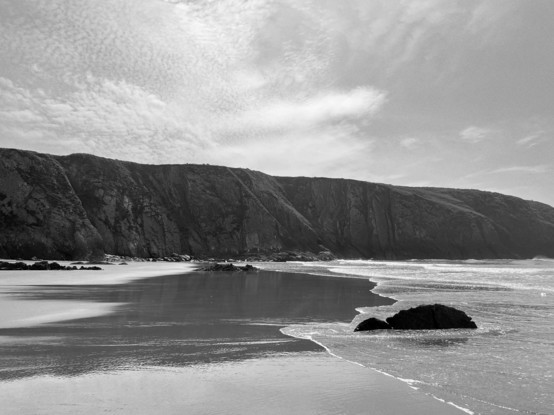 A black and white beach view