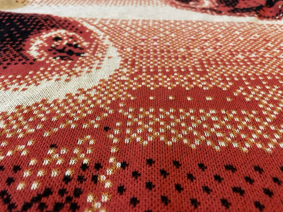 Close up of the sweater weave pattern 