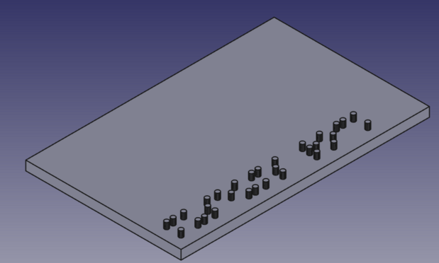 Screengrab of an isometric view of a grey rectangle, rendered in FreeCAD.  Along the bottom edge of it there's a pattern of raised dots from some braille text