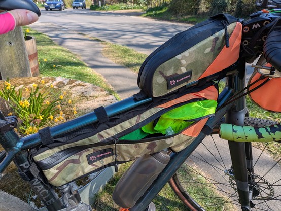 A bike with a load of bags strapped to it