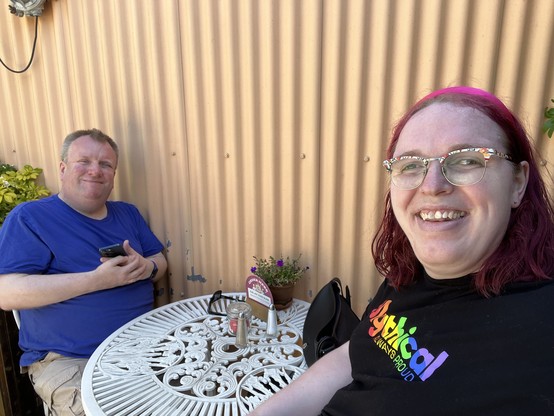 Jae and James sitting at a table