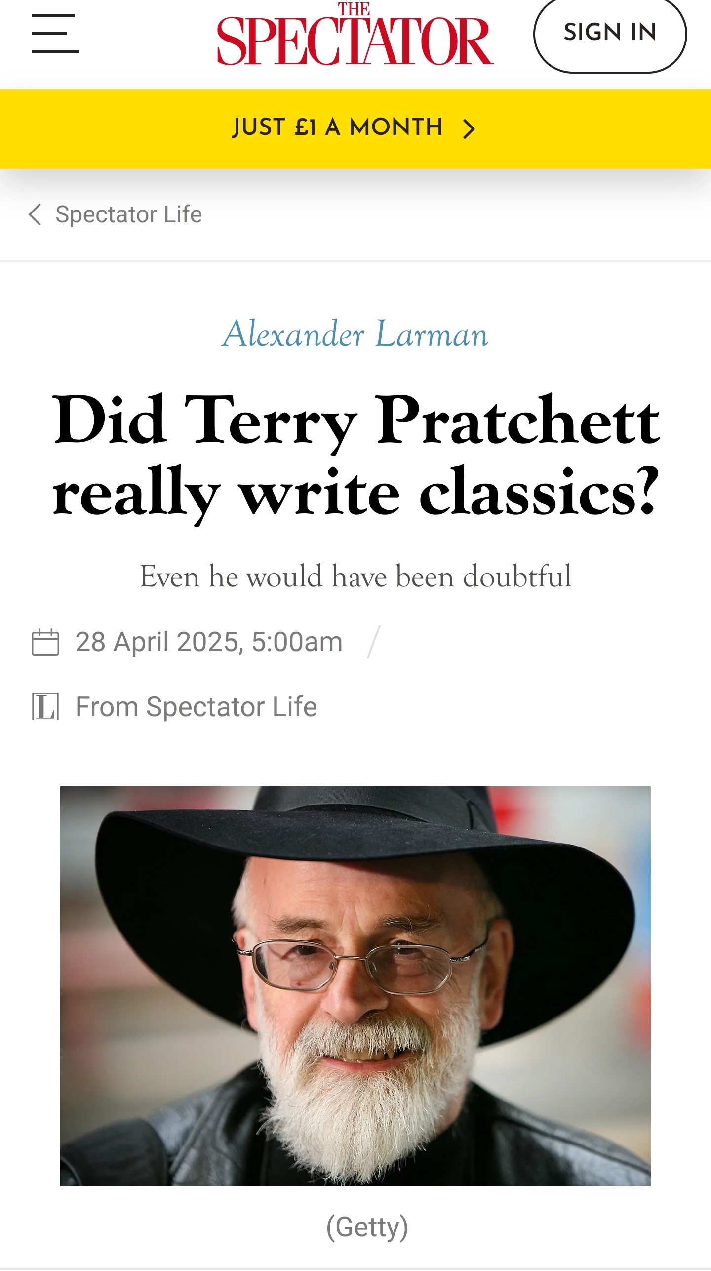 Screenshot of a Spectator article titled 'Did Terry Pratchett really write classics?' by Alexander Larman, published 28 April 2025. The header shows 'JUST £1 A MONTH' in bright yellow. Below the title is an image of Terry Pratchett with his iconic white beard and signature black wide-brimmed hat, peering thoughtfully through his glasses. The subtitle reads 'Even he would have been doubtful' - which is rather apt considering how he'd likely have scoffed at being labelled a 'classic' author whilst secretly being chuffed about it.