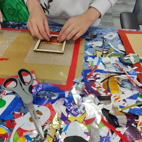 A visitor putting together their soft plastic picture